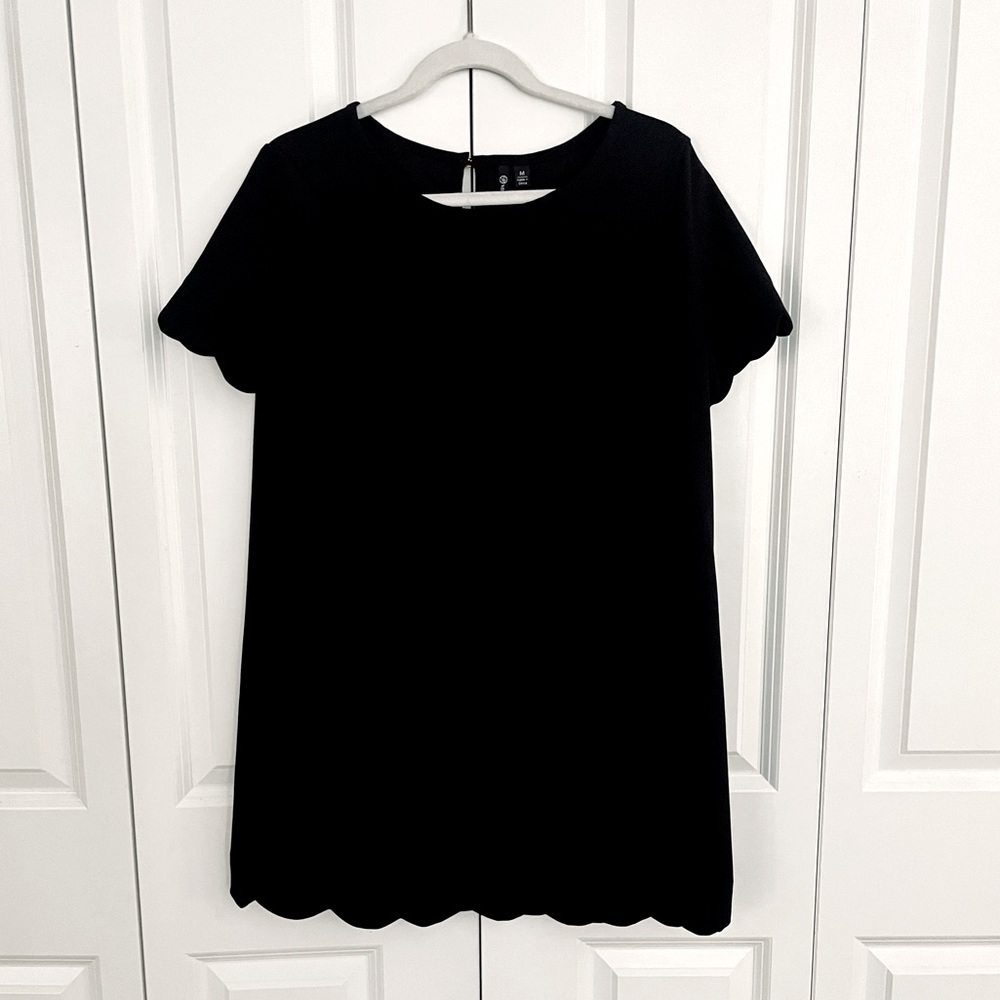 Black dress with scallop bottom & scallop sleeve detail